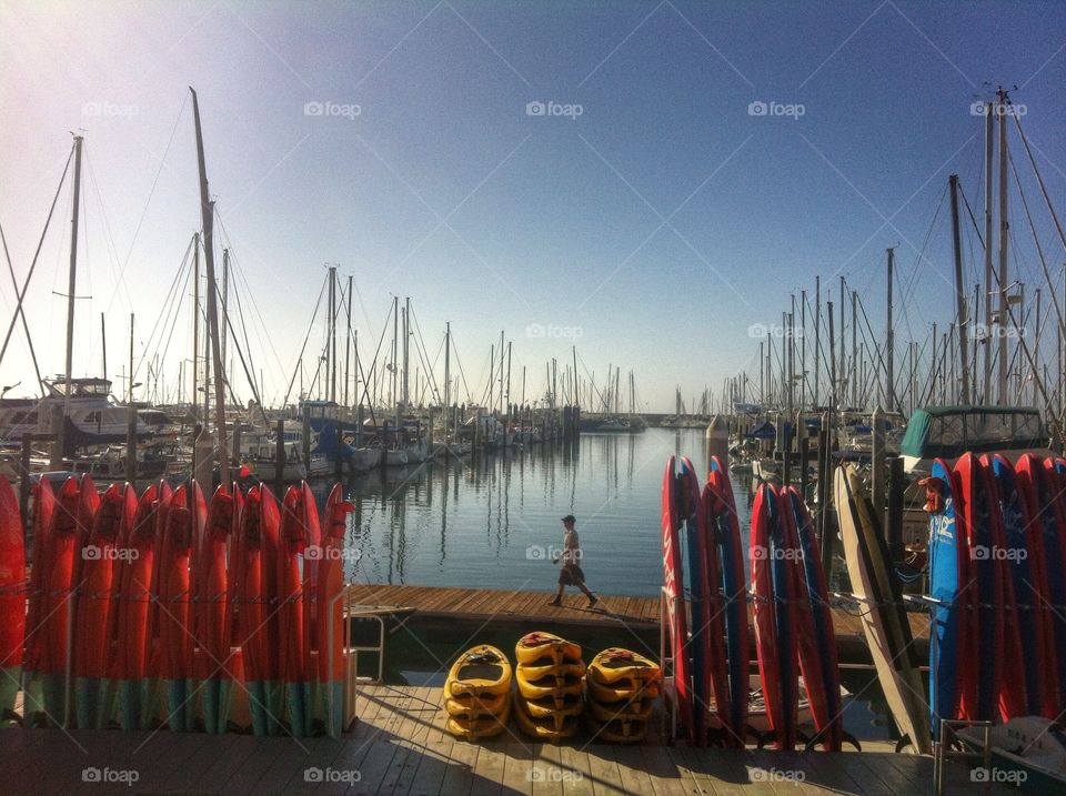 Side view of person walking on pier