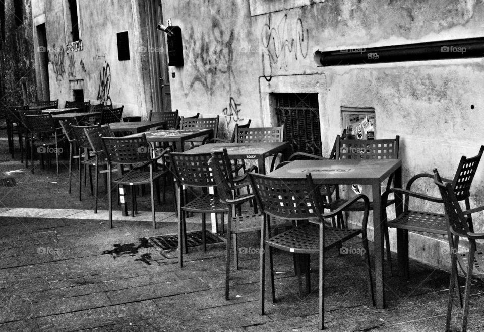 Empty Cafe. Vacant sidewalk cafe in Trento, Italy