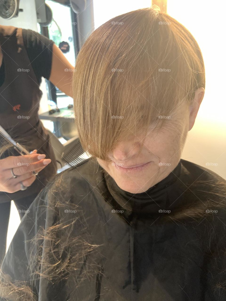 Woman during haircut 