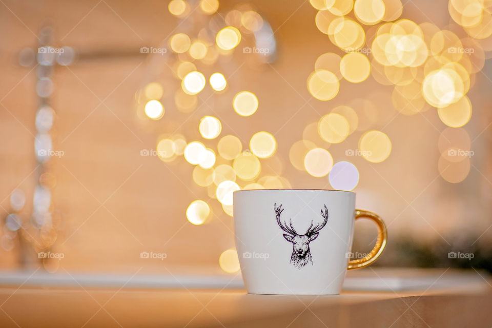 cup of coffee in a cozy festive Christmas atmosphere