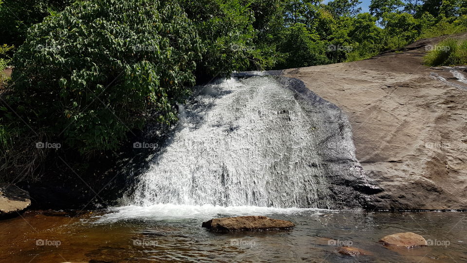 Rain creates waterfall.