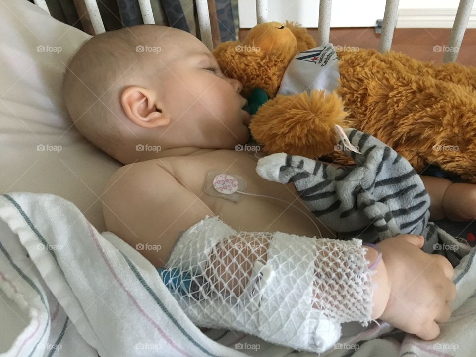 Cute baby sleeping on babybed