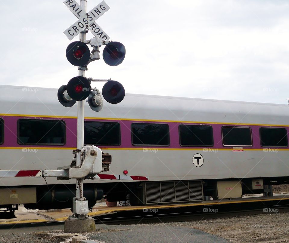 Train crossing . Commuter rail bringing home the people who work in town