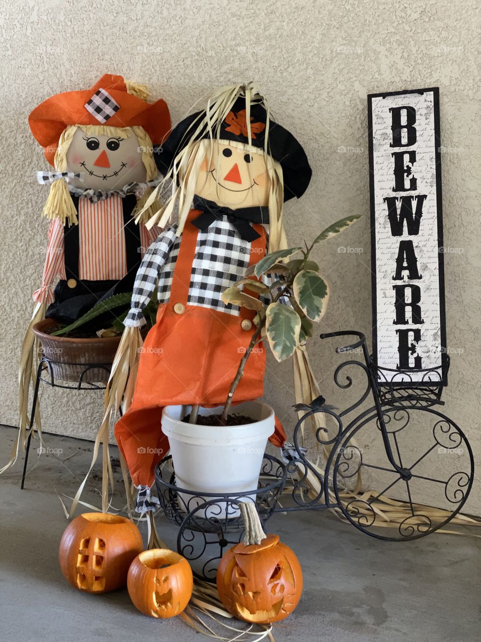Beware an apartment front entrance  with Halloween decorations in the month of October 