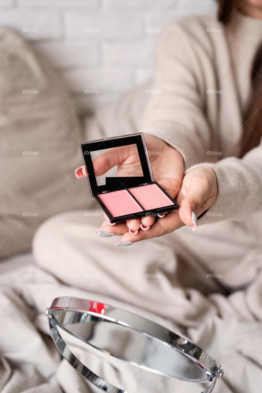 woman using cosmetics