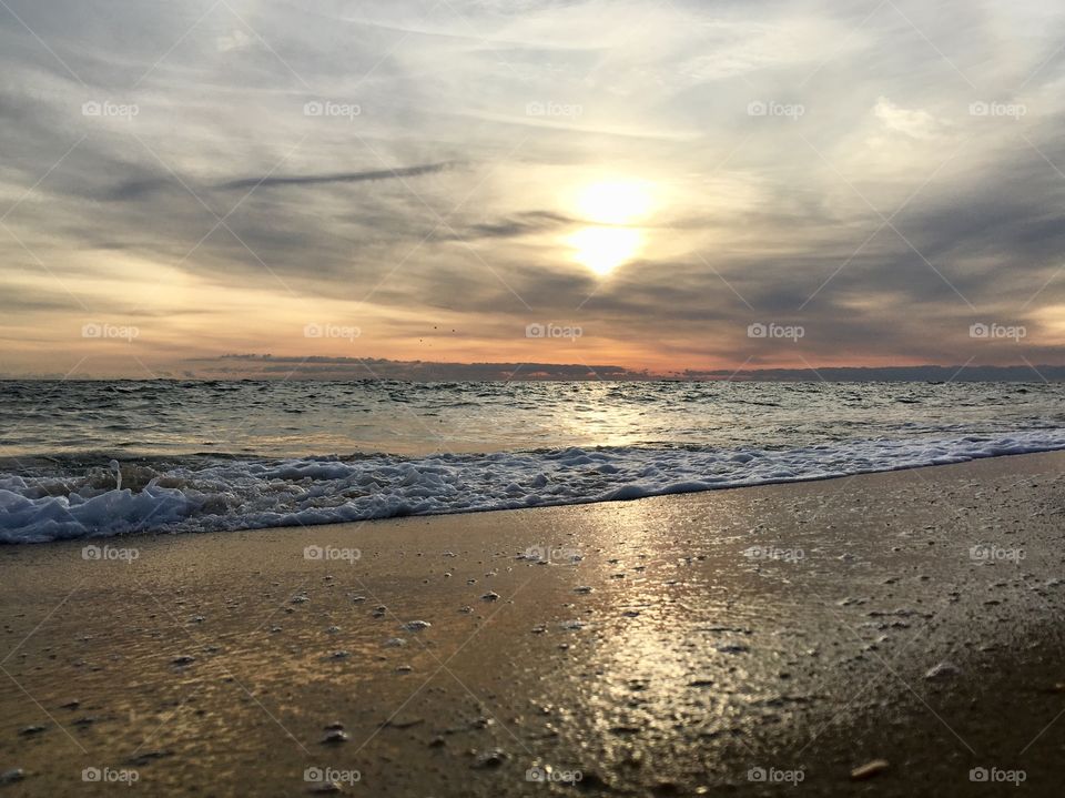 Dawn sunrise reflection on the beach
