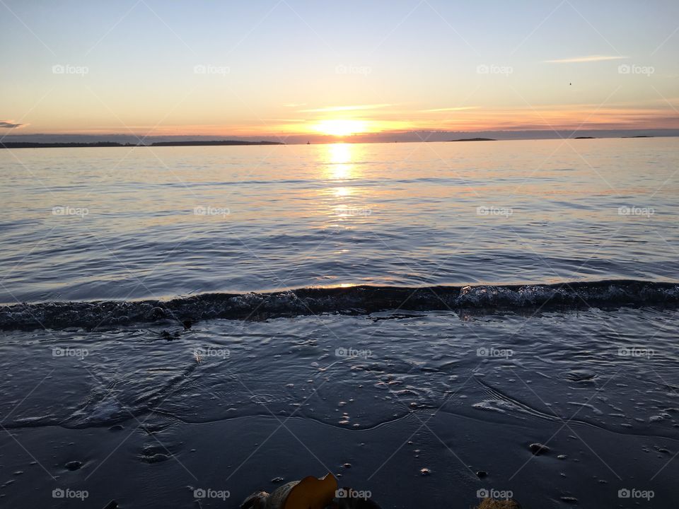 Scenic view of sea at sunset