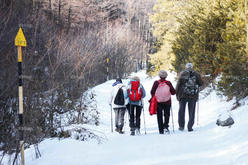 People walking at the winter mountain