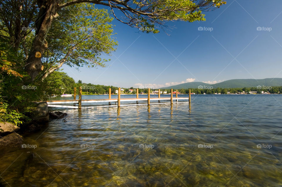A dock on the calm summer day in Santa Barbara New Hampshire