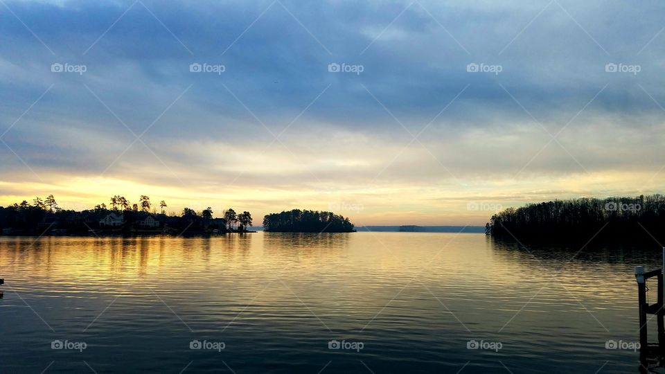 dawn on the lake durin calm  skies