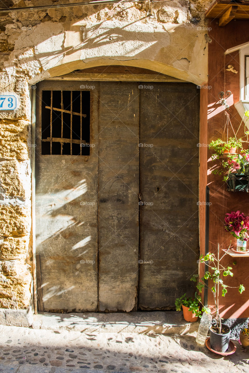 Old door in the city of Cefalu on Sicily.