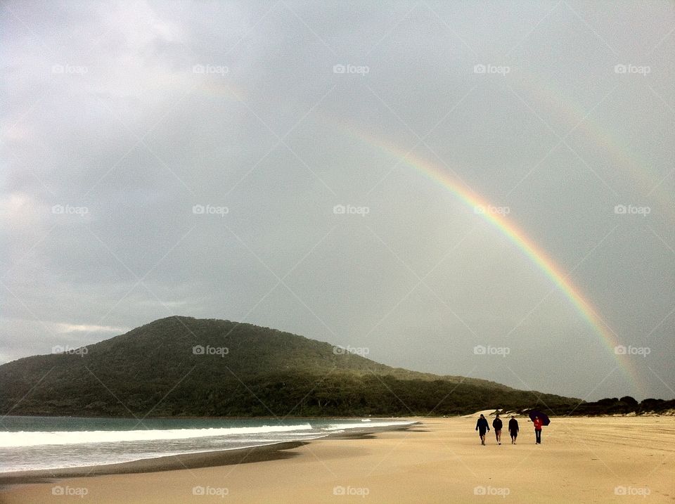 Rainbow over the mountain on the beach