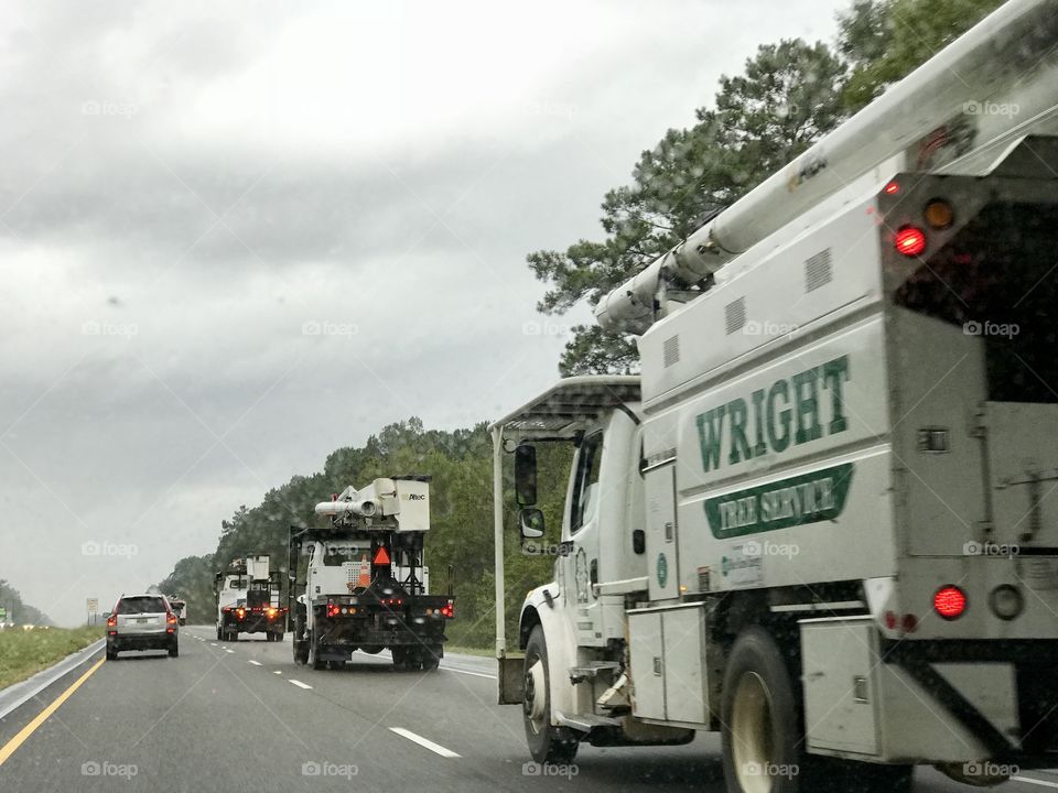 Following a convoy of tree trimming trucks on I 65 south. Wright tree trimming