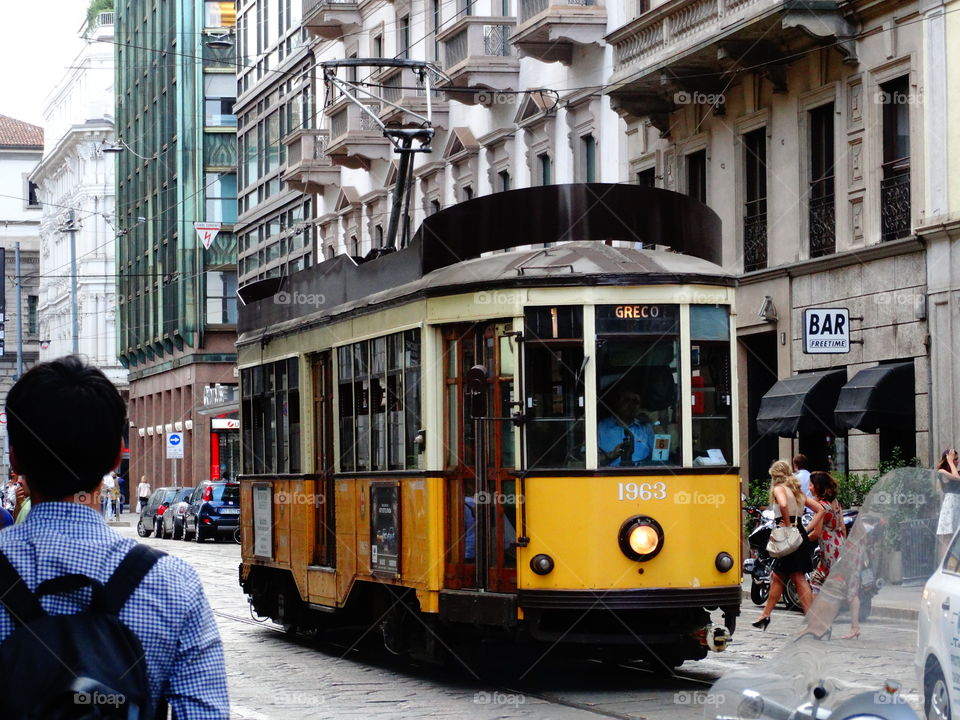 A tram crisscrossing the old streets of Milan.