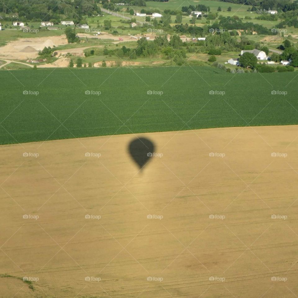 Shadow over the fields.  Flying high