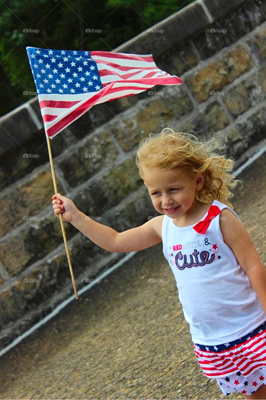 Girl holding American flag