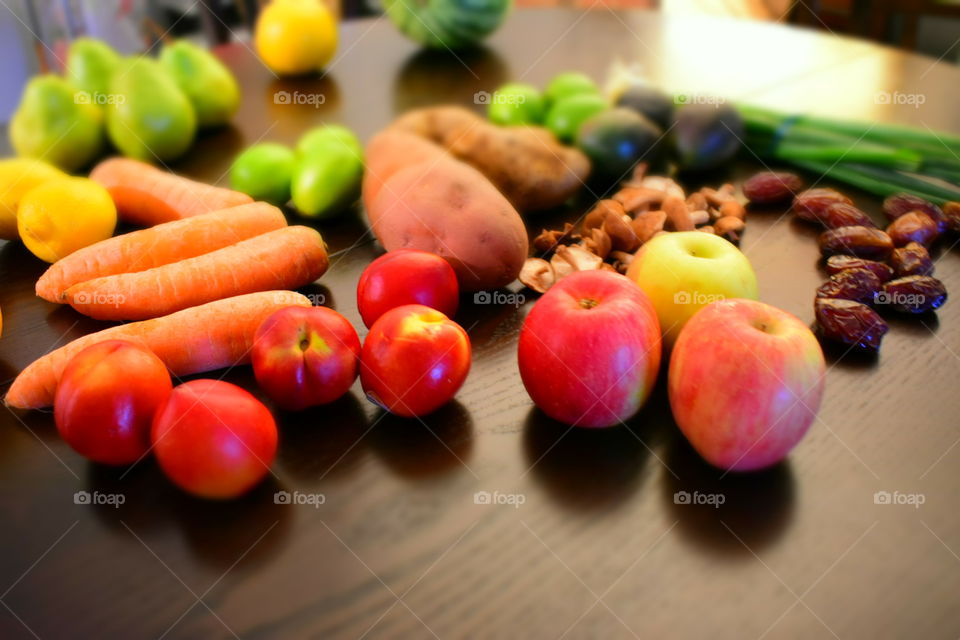 Produce haul, colorful fruits and vegetables on wood table