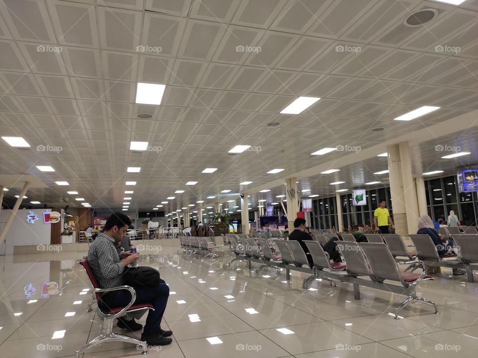 A picture of people waiting at Tehran airport