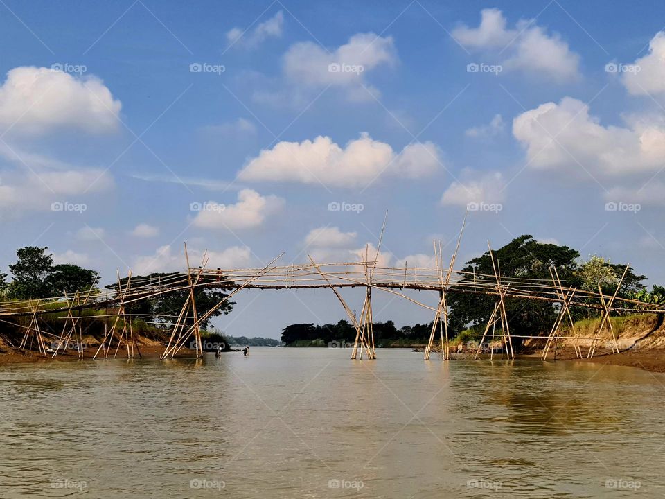 Bamboo bridge over the stream in the rural area, of Irrawaddy delta region in Myanmar (Burma)