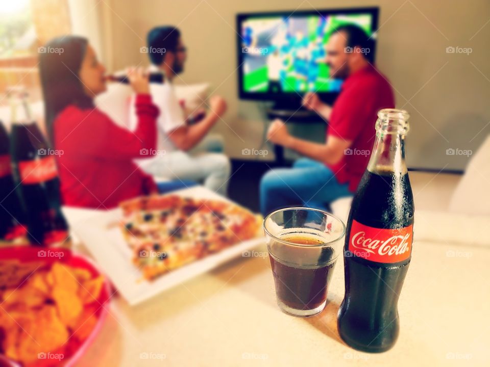 Enjoying the game with Coca Cola! 