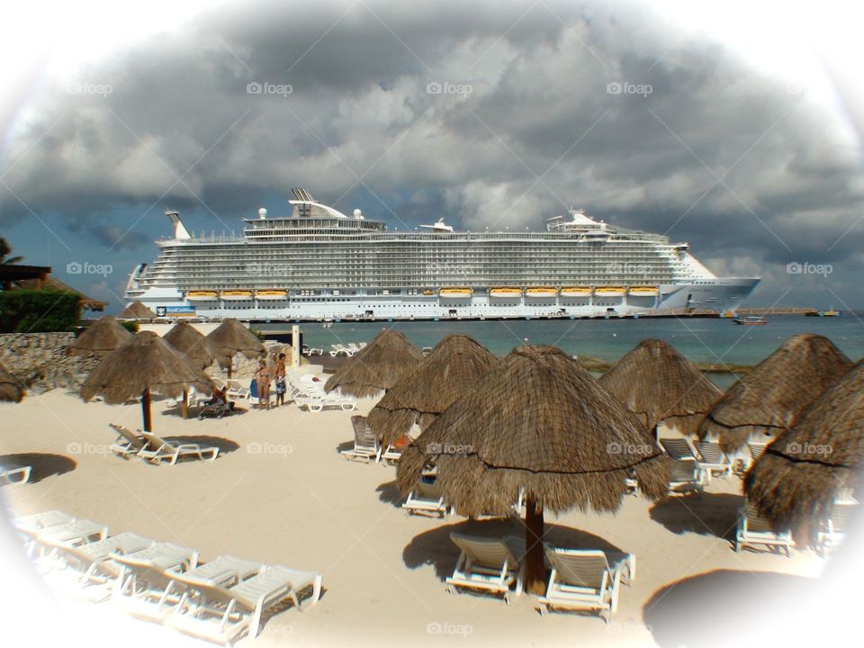 Oasis of the Seas. One of the worlds largest cruise ships as seen from a private beach in Cozumel, Mexico