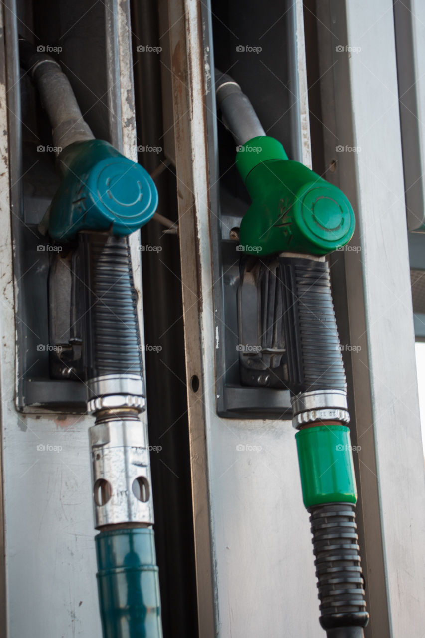 Two grades of green color gas hose in the Gas station