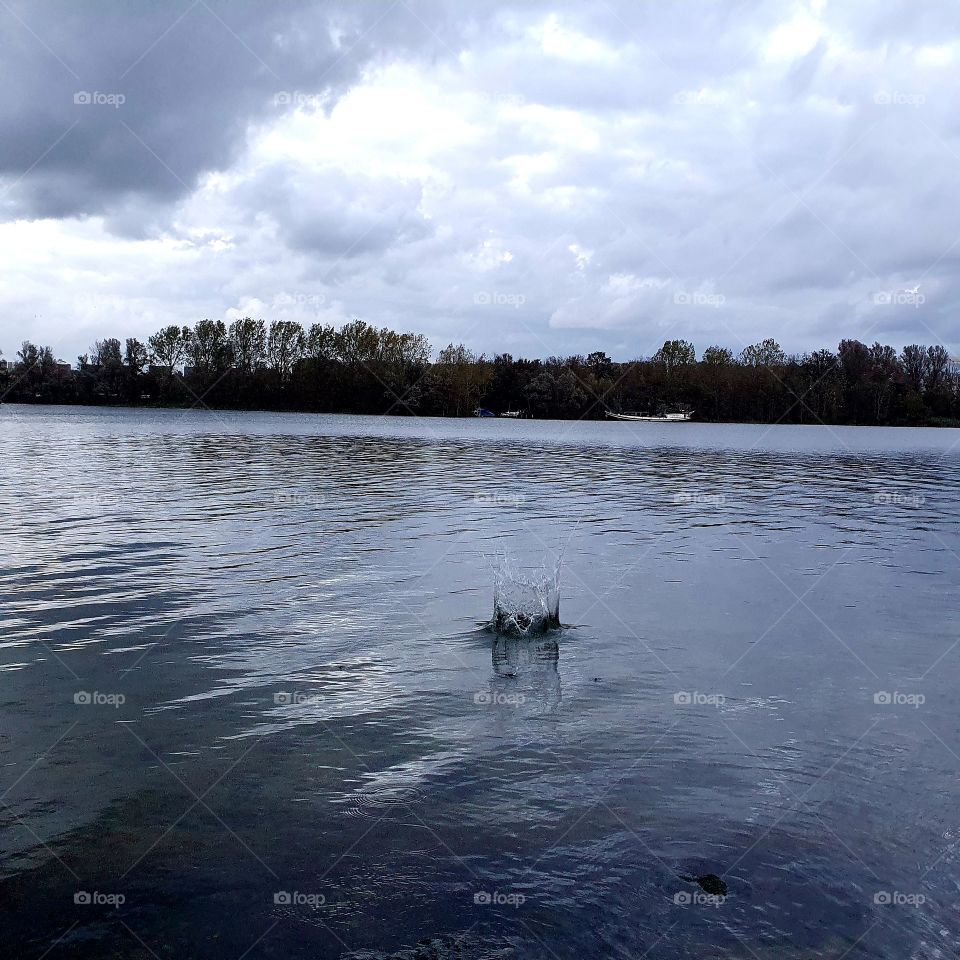 Stone makes a splash in water.