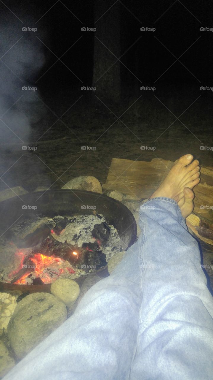 Relaxing next to an open fire.