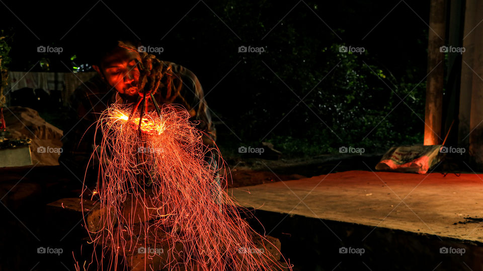 A story of a work man who was in fire.. Adjusted the shutter speed and Iso to draw these lines....