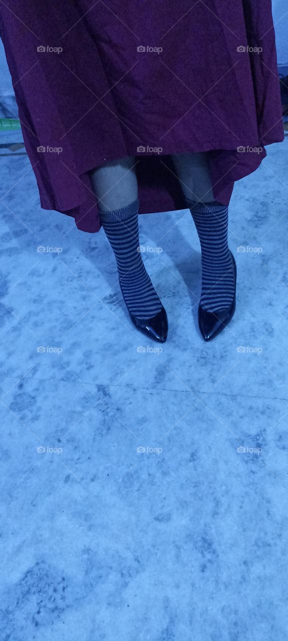 legs of young preety model with black brown socks