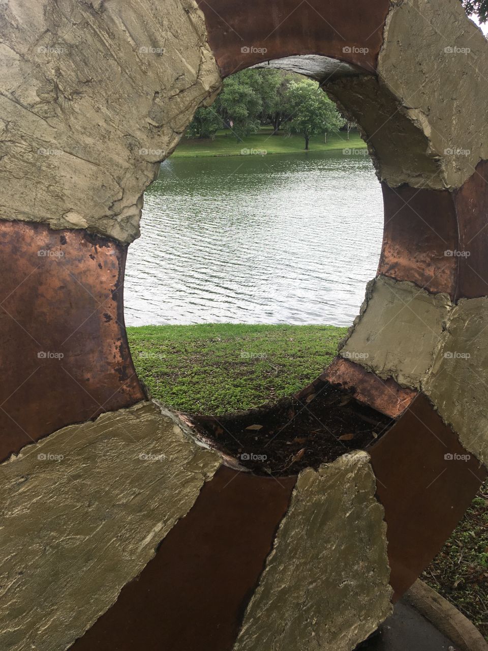 Pond through a sculpture 