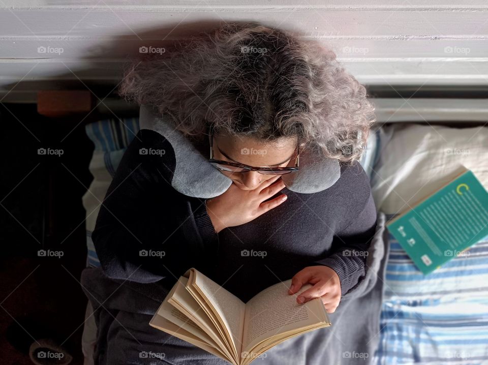 Woman reading in bed