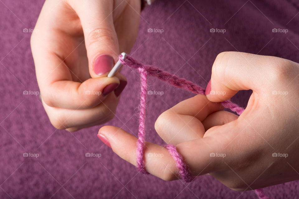 Close-up of women knitting