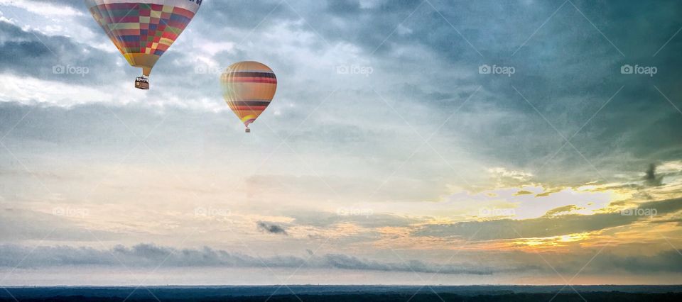 Hot-air balloons ride with sunrise view 