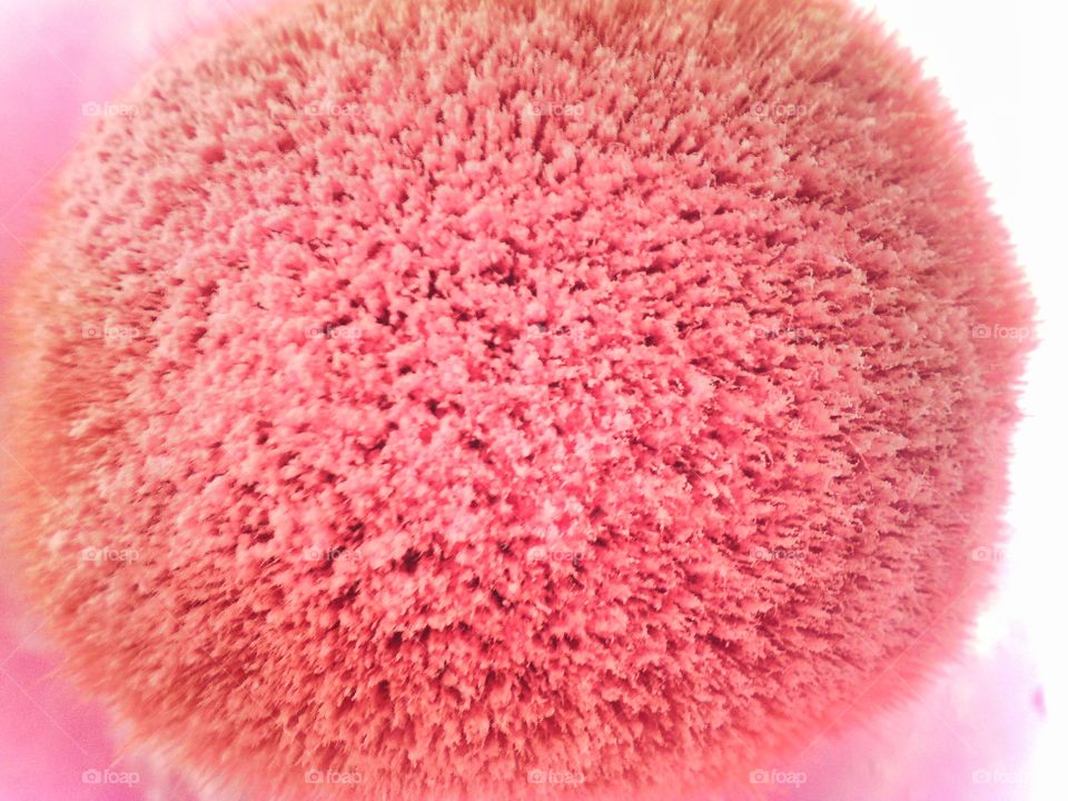 Close up snap of my make up brush with my pinkish loose powder.