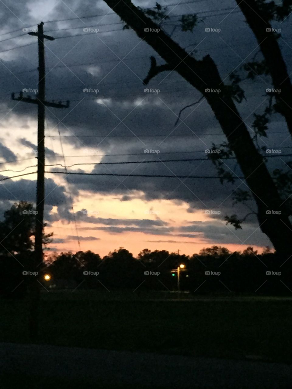 Very dark clouds and a pink sunset.