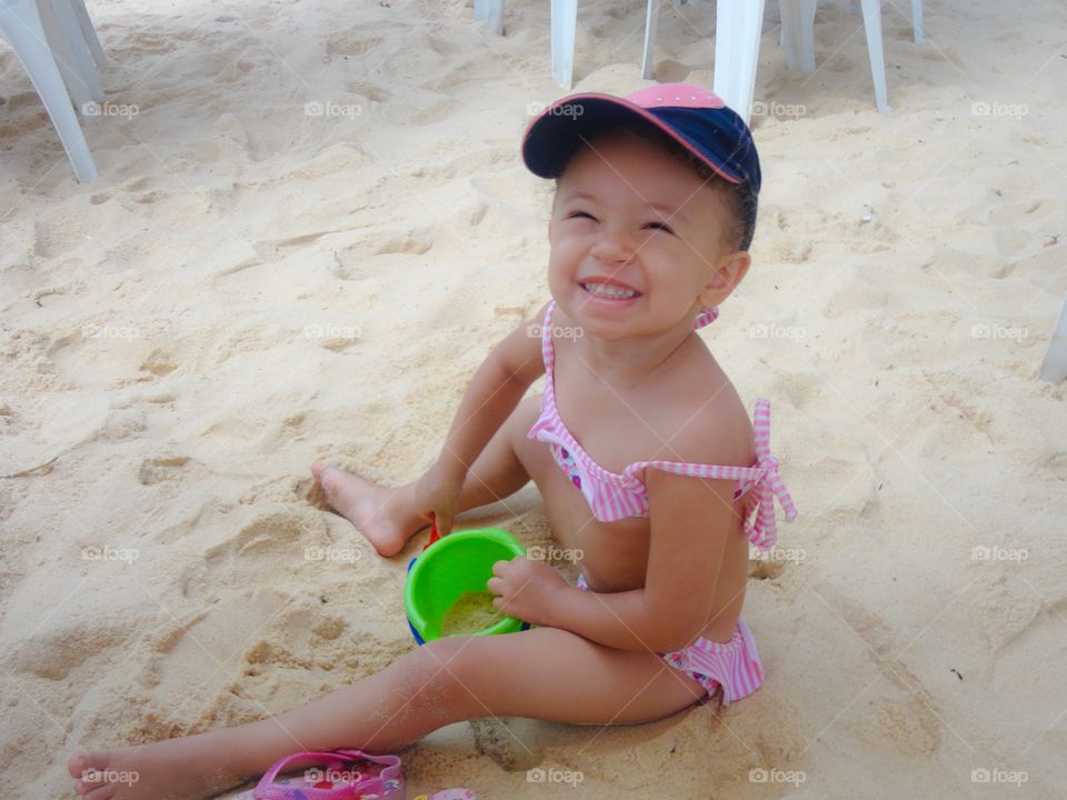 Girl playing on beach