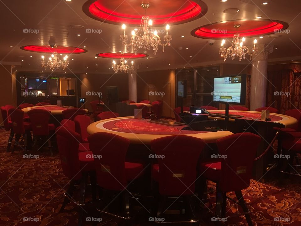 Casino lights red tables chandeliers monitor game bet money lose