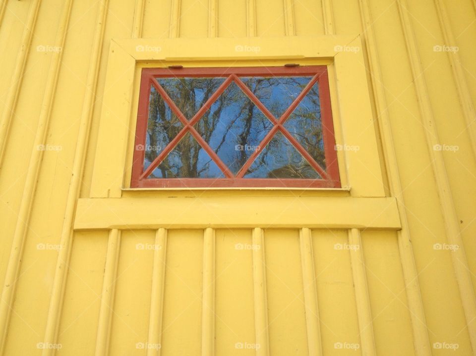 Yellow wall red window