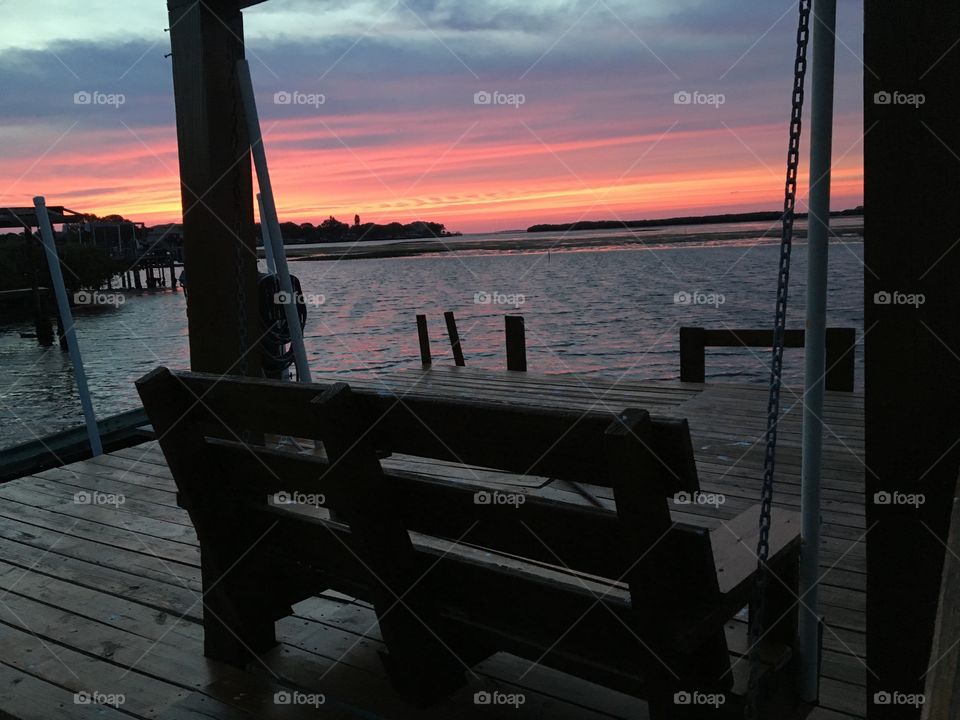 Dock swing sunset
