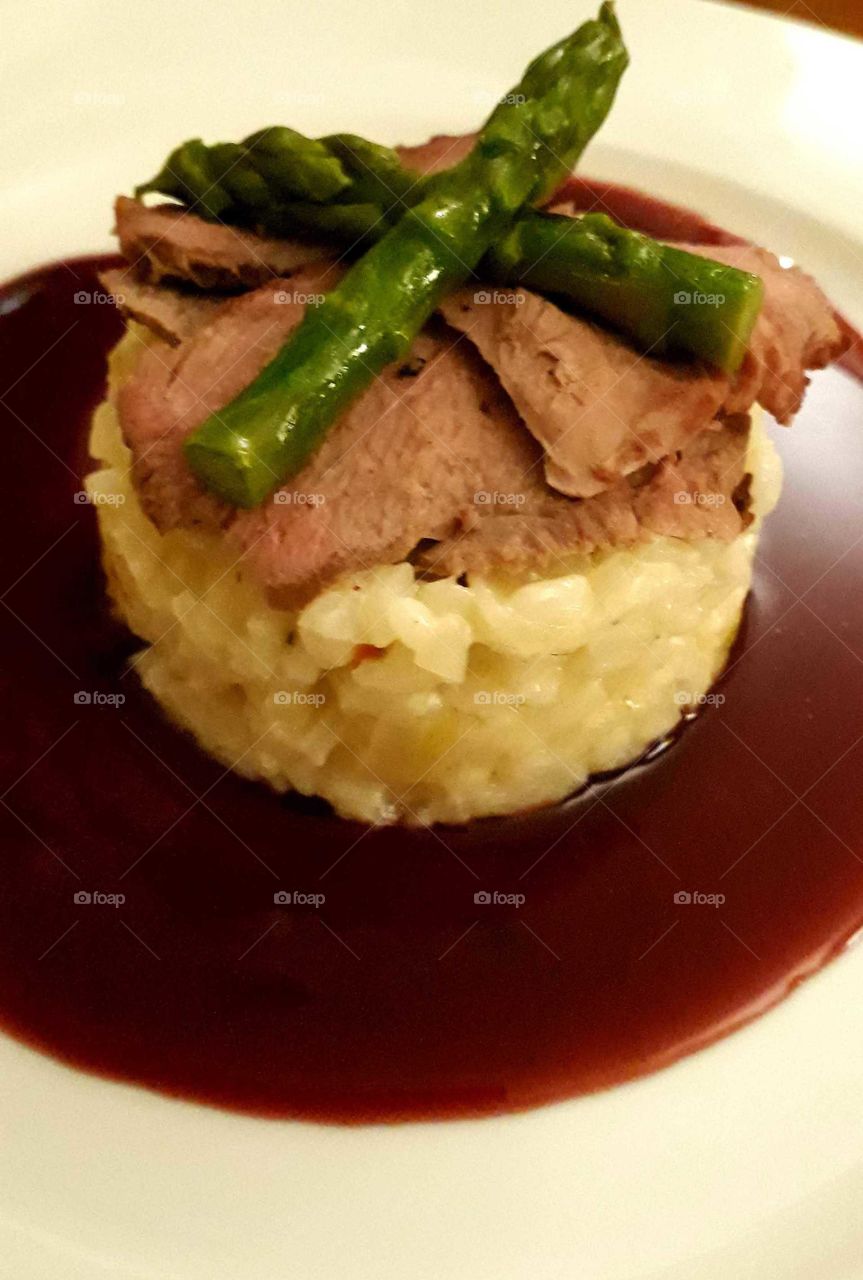 Roast Duck on Risotto with Red Current Jus