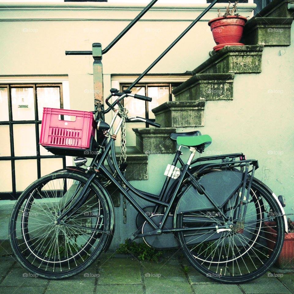 Two bicycles parked in the street in Amsterdam, the Netherlands