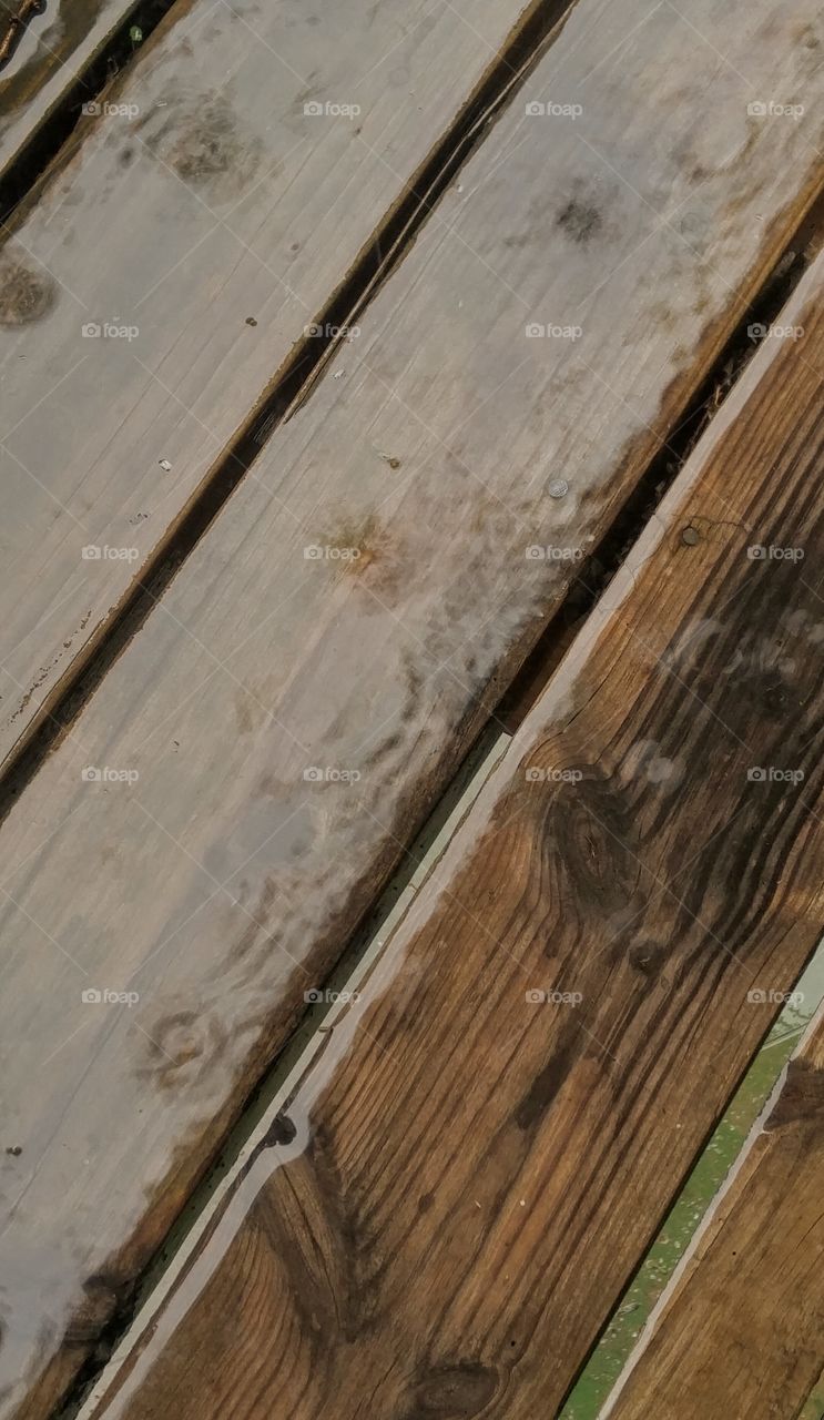 rain falling on wooden balcony floor
