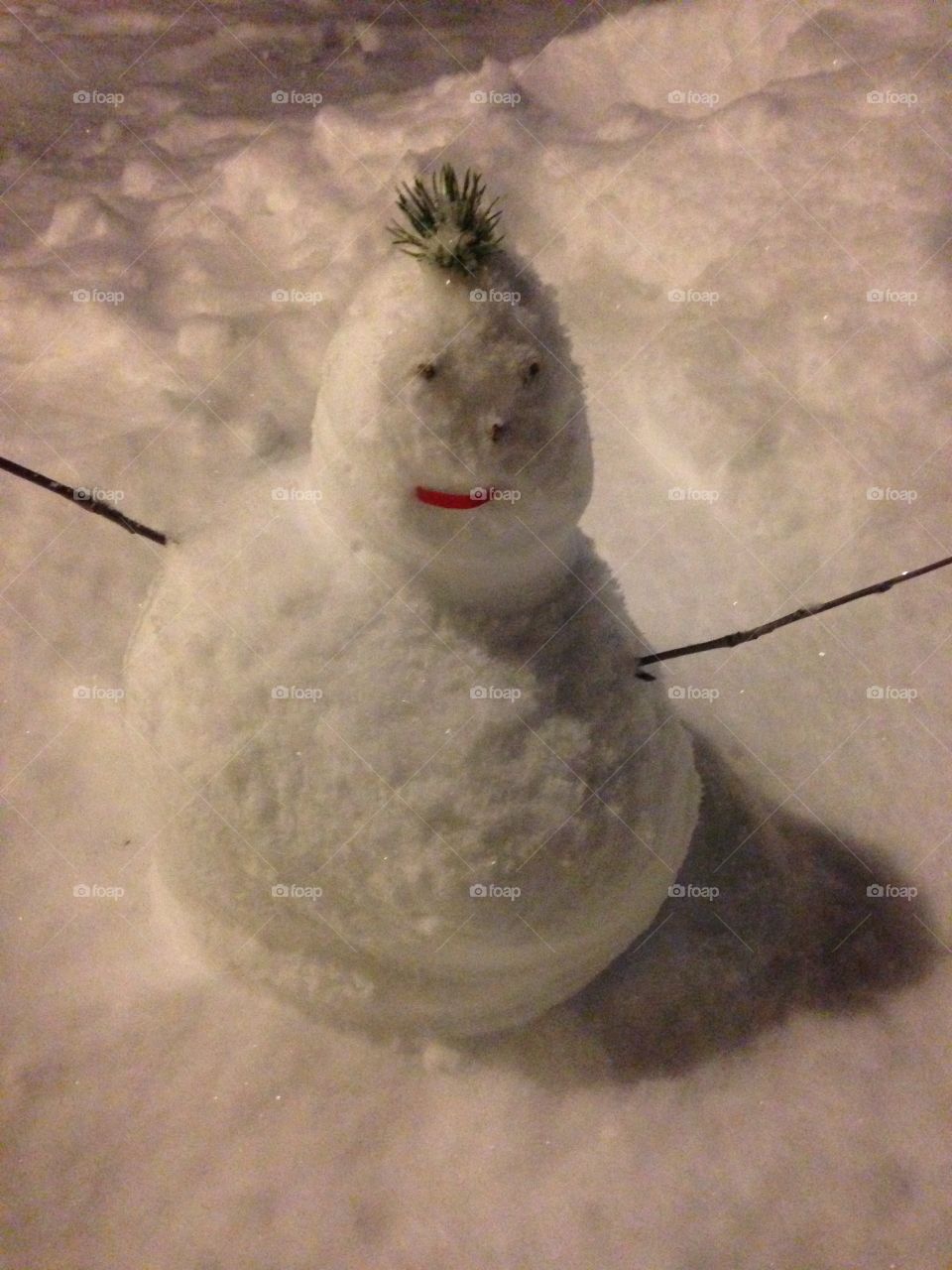 a snowman made by young children.