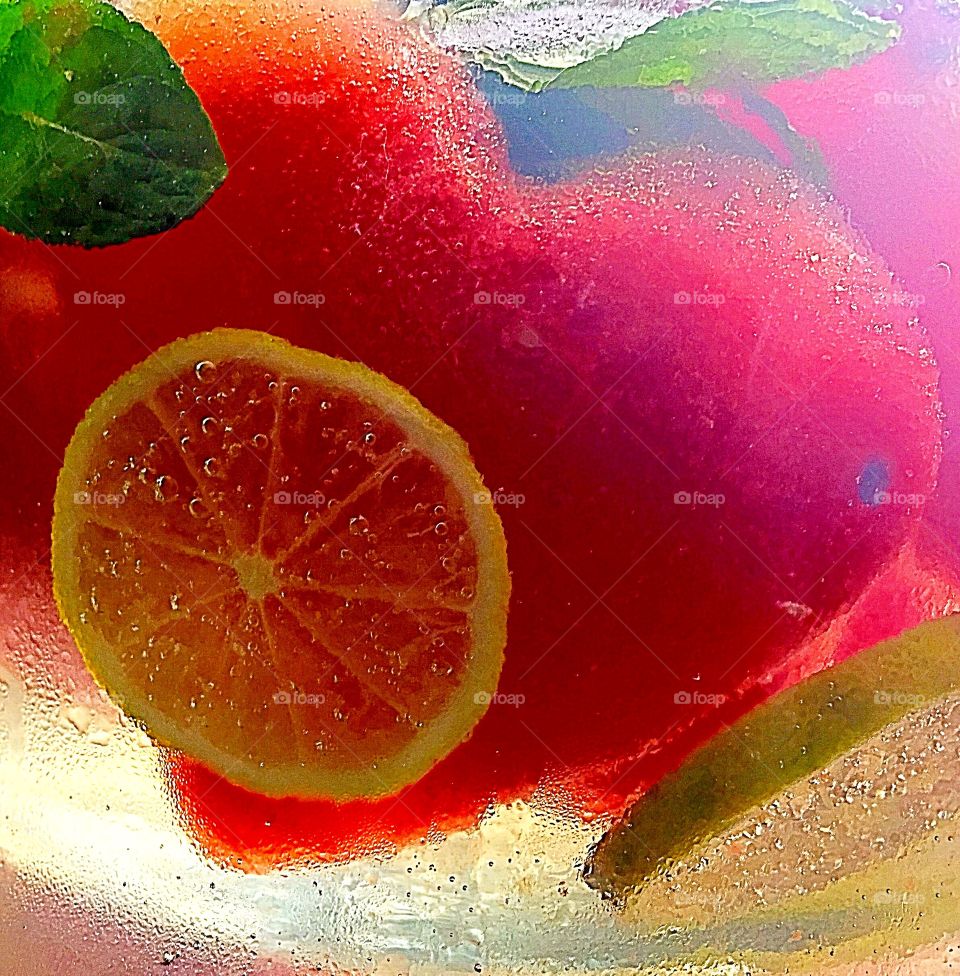 Sparkling lemonade infused with frozen heart shaped watermelon lime and fresh mint leaves 