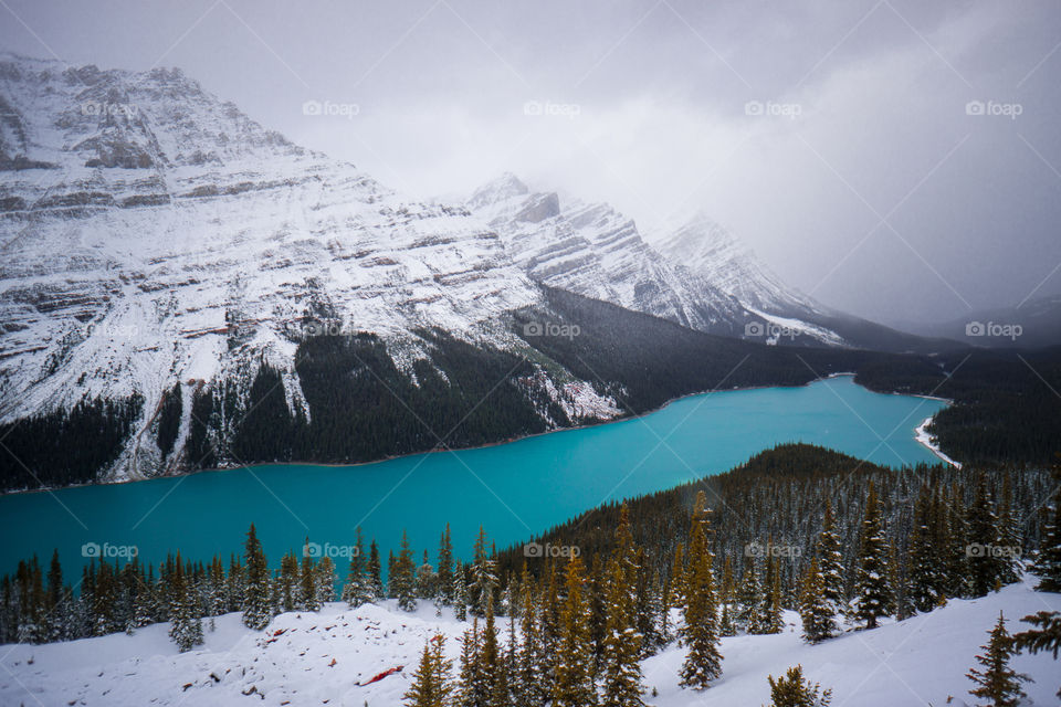 Scenic view of snowy mountains and idyllic lake