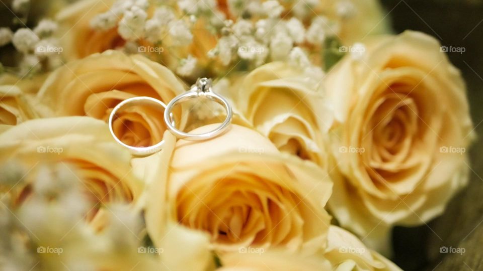 wedding ring in the middle of a rose