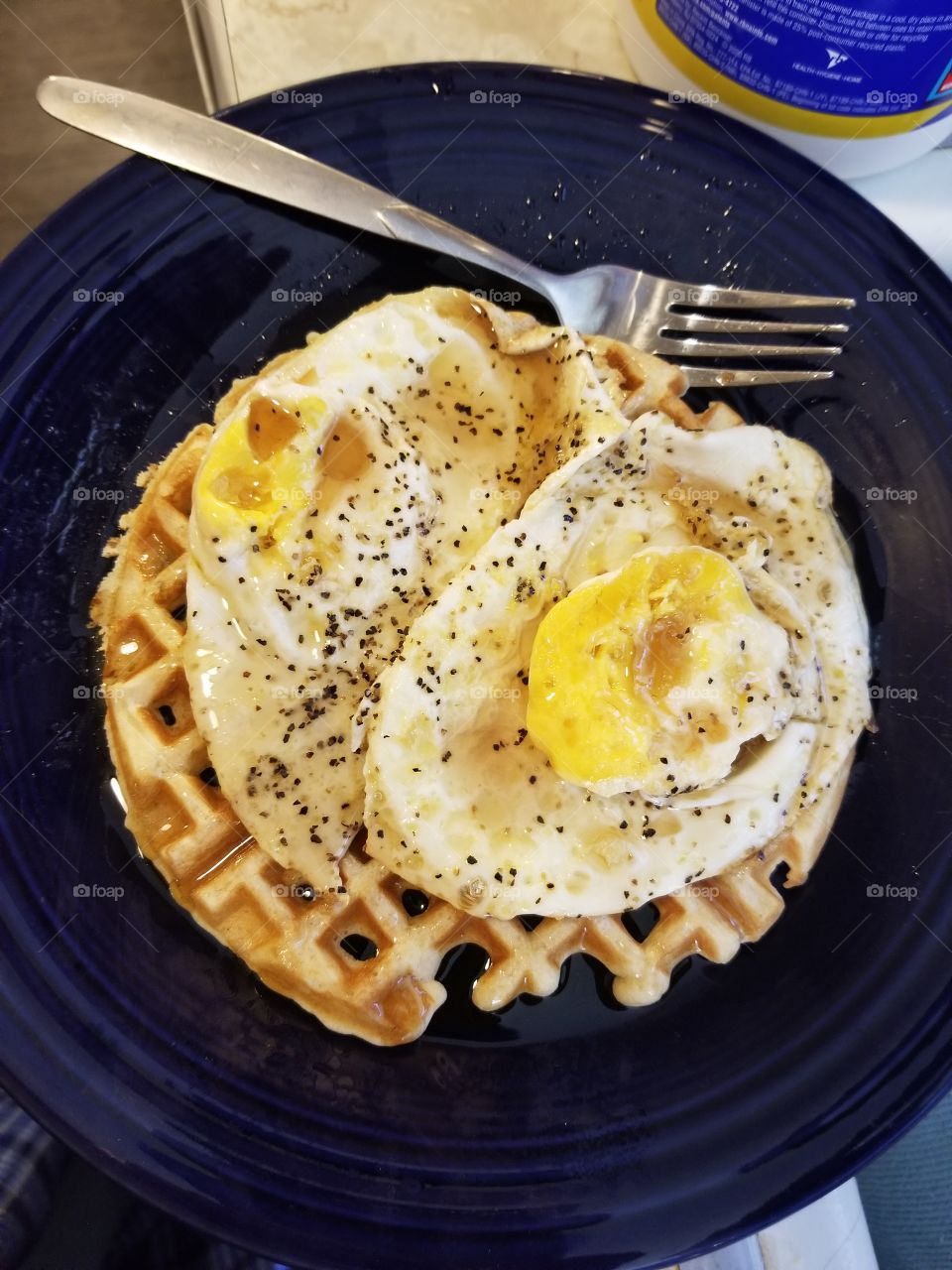 Fried Eggs over Waffle with fork