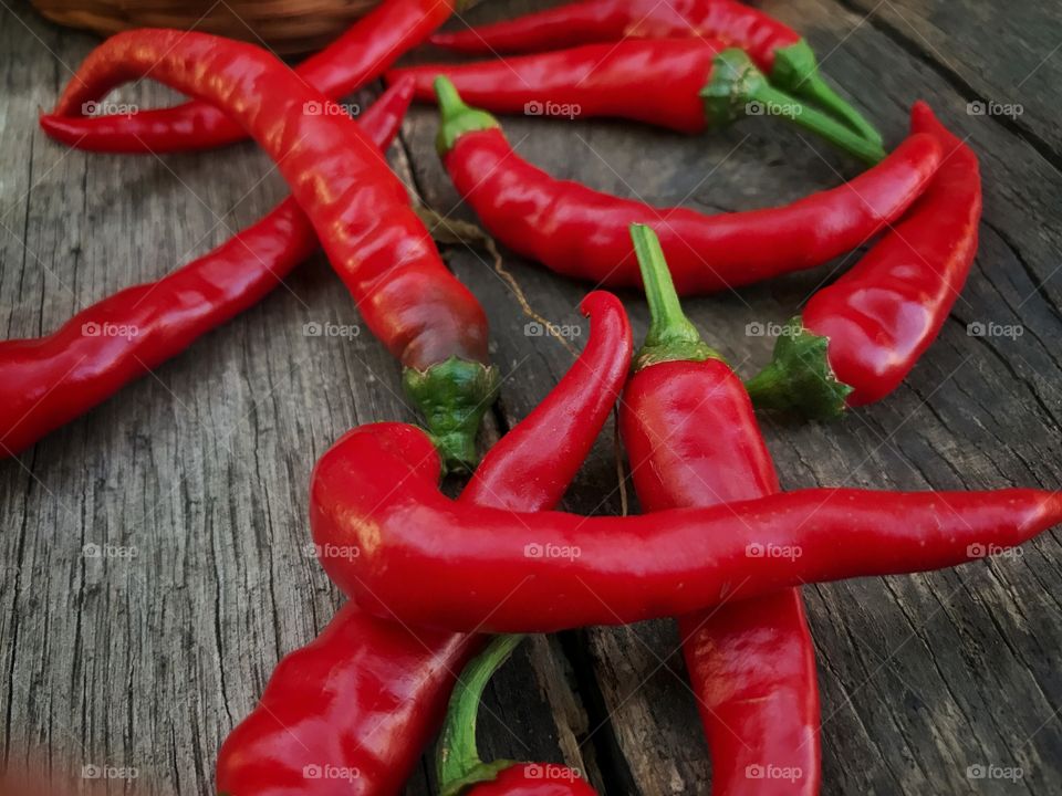 Red chillies on wood