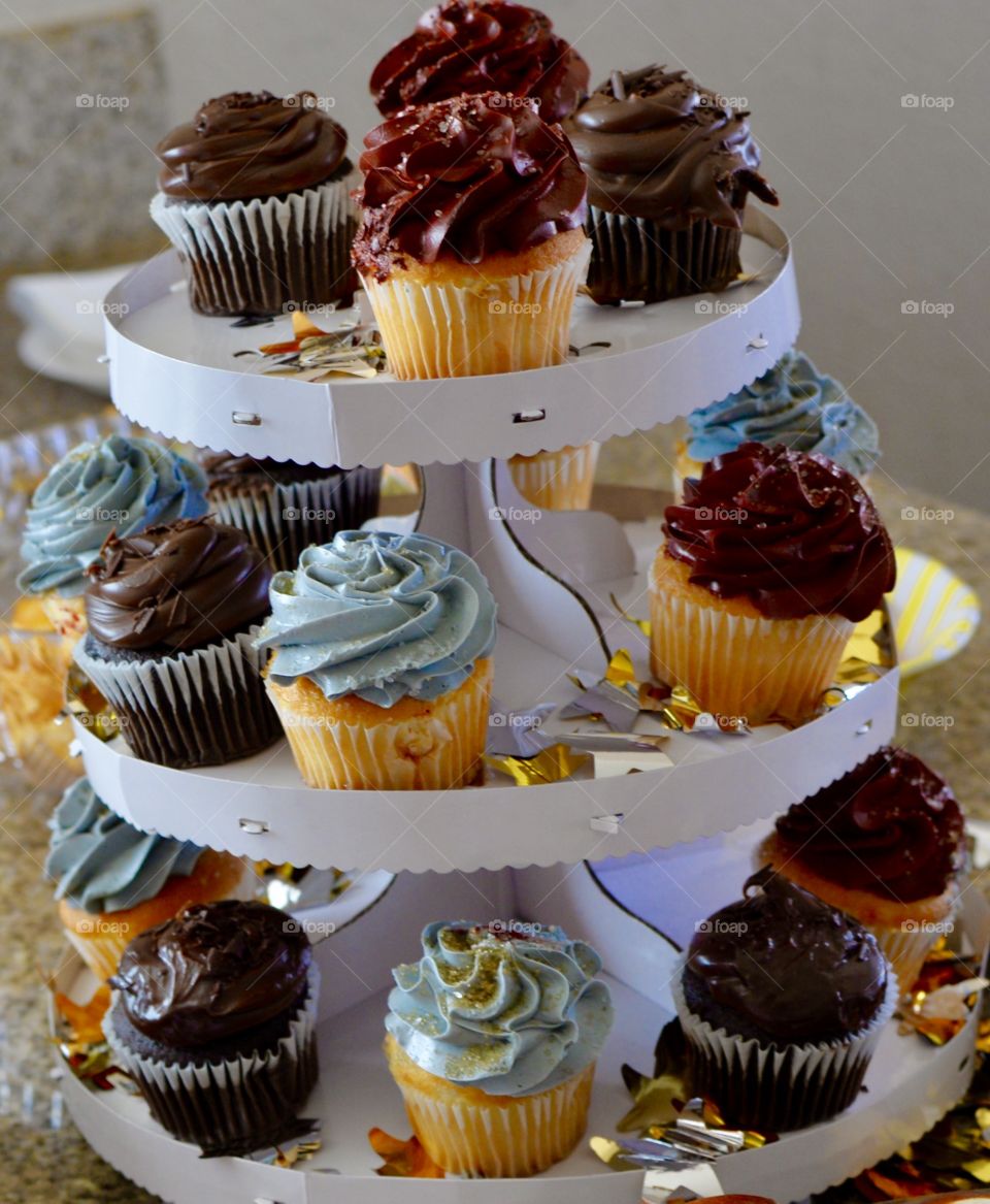 Tasty and delicious cupcakes on a simple stand 